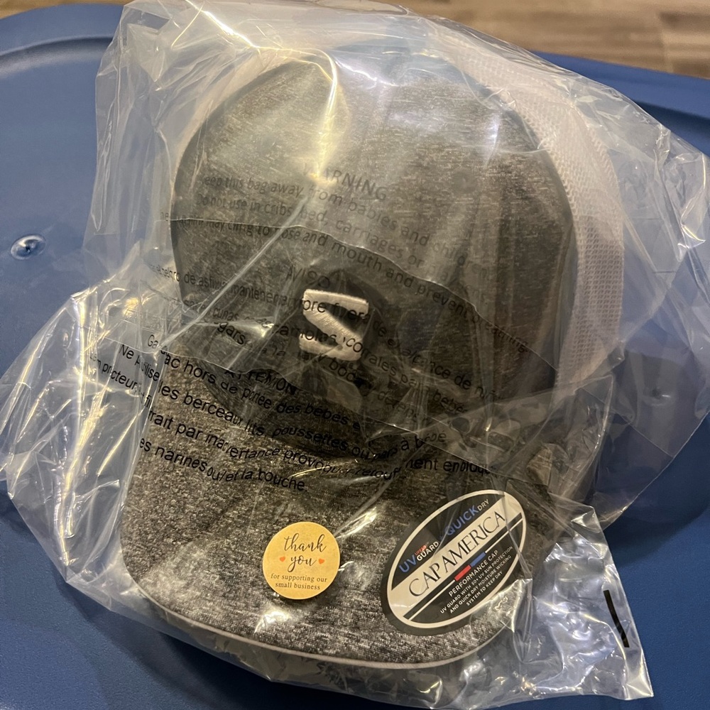 Salomon Trucker Hat. Brand New. Still in package from when I purchased.